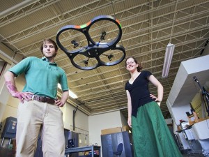 _a quadcopter flying in front of my labmate Jake and I_