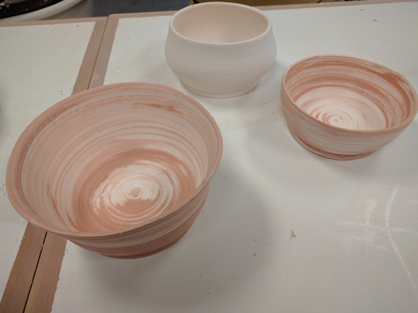 unglazed bowls with two clays so you can see the swirling of the white and brown clays together