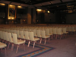 _large conference hall at GHC 2010 filled with rows of empty chairs_