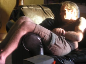 human male asleep in a chair, in the sunshine