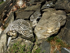 _several large rocks modified to look like faces_